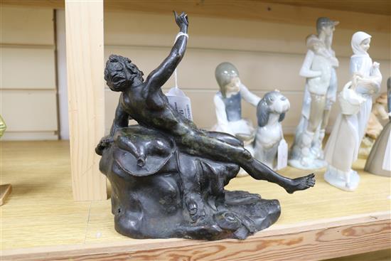 A bronze of a reclining man height 24cm